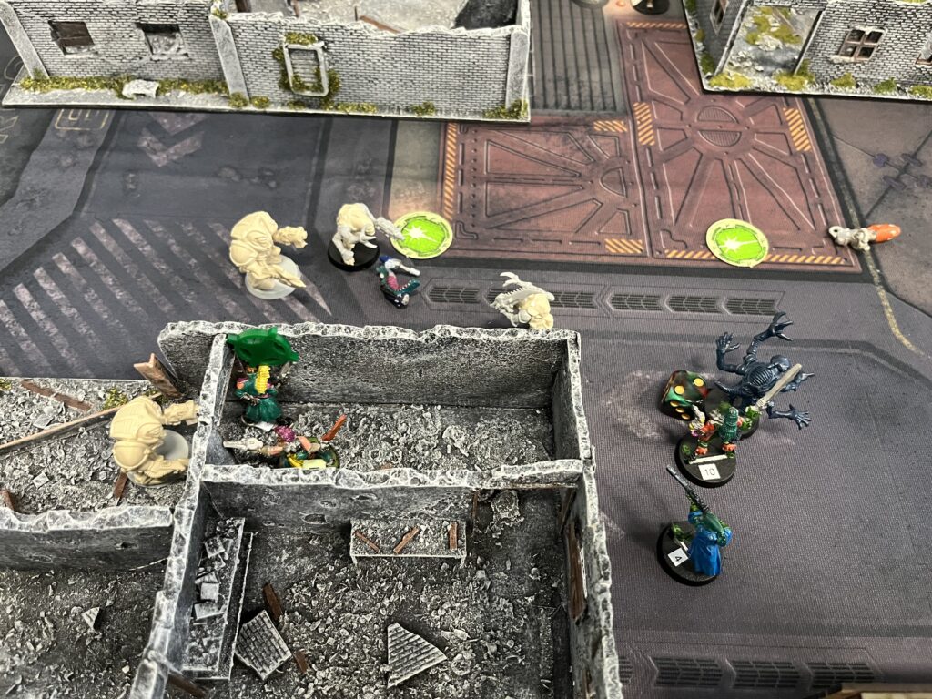 A close up of a room in a building. A zombie is trying to get into the room, but is blocked by the Void Dragons. Outside the room Sarge is in close combat with another zombie. There are another 3 zombies milling around.