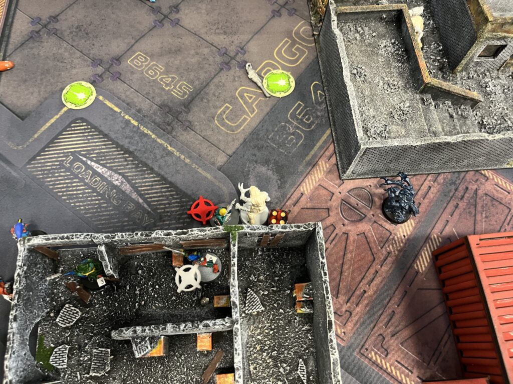 Overhead shot showing a zombie entering close combat with Headcase. Markers indicate the zombie has 4 health left but Headcase is stunned